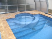Строительство бассейна с зоной гидромассажа в пристройке к дому с раздвижным павильоном